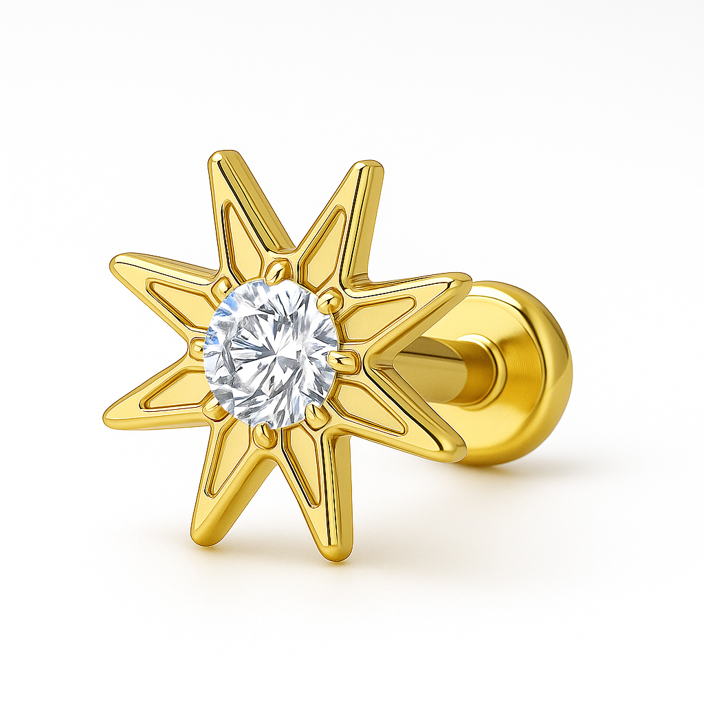 Gold star-shaped earring with a clear gemstone on a white background