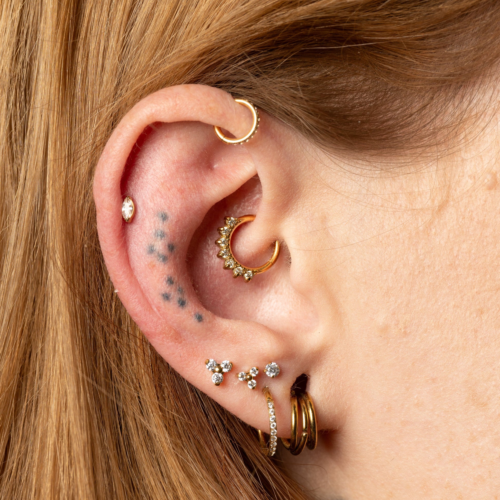 Close Up of ear curation showcasing daith and helix jewellery