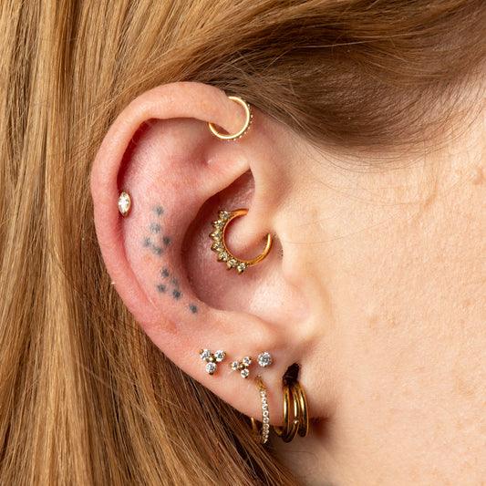 Close Up of ear curation showcasing daith and helix jewellery